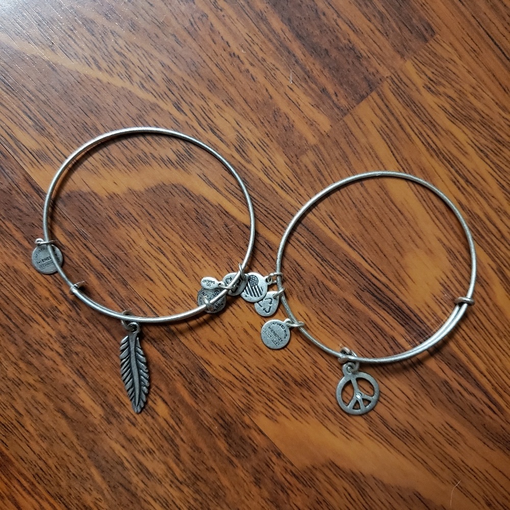 Feather and Peace sign Alex and Ani bracelets